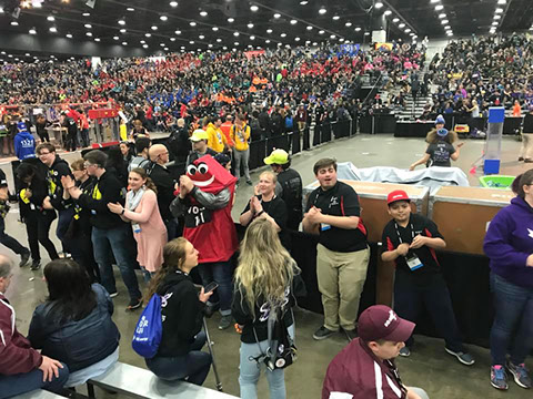 Our mascot and some of our students having some fun dancing between matches.