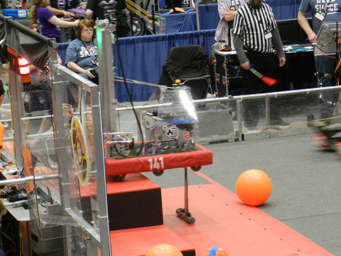 Our robot climbing onto the top platform at the end of the game