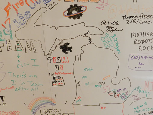 Someone drew the state of Michigan on the community white board; which then started teams from Michigan and Indiana to label where they're from.