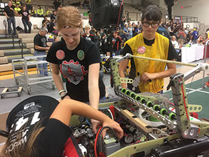 Girls Fixing the Bot